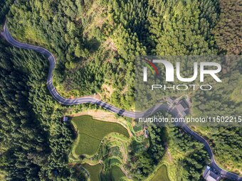 An aerial photo shows a rural road in Baidao village, Congjiang county, in Congjiang, China, on August 22, 2024. (