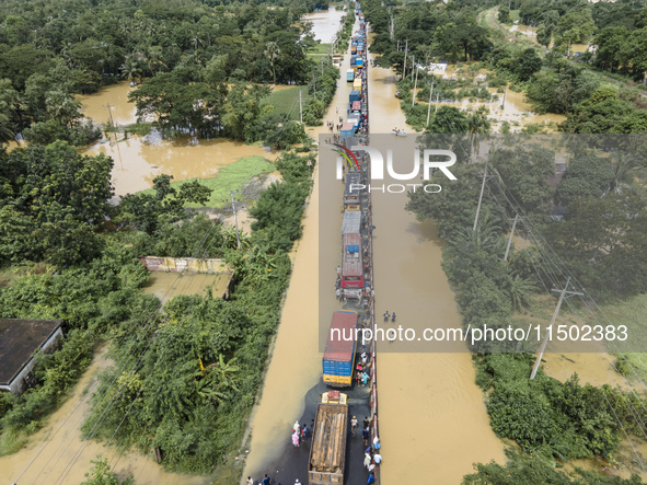 An aerial view of the flooded Dhaka-Chittagong Highway in the Muhuriganj area of Feni district in the Chittagong division of Bangladesh. At...