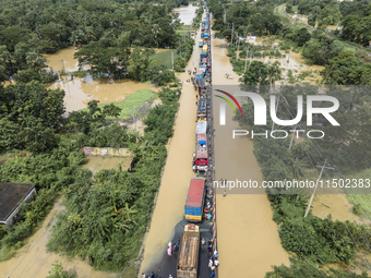 An aerial view of the flooded Dhaka-Chittagong Highway in the Muhuriganj area of Feni district in the Chittagong division of Bangladesh. At...