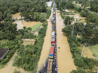 An aerial view of the flooded Dhaka-Chittagong Highway in the Muhuriganj area of Feni district in the Chittagong division of Bangladesh. At...