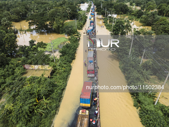 An aerial view of the flooded Dhaka-Chittagong Highway in the Muhuriganj area of Feni district in the Chittagong division of Bangladesh. At...