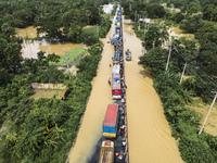 An aerial view of the flooded Dhaka-Chittagong Highway in the Muhuriganj area of Feni district in the Chittagong division of Bangladesh. At...