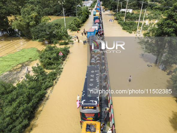 An aerial view of the flooded Dhaka-Chittagong Highway in the Muhuriganj area of Feni district in the Chittagong division of Bangladesh. At...