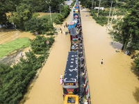 An aerial view of the flooded Dhaka-Chittagong Highway in the Muhuriganj area of Feni district in the Chittagong division of Bangladesh. At...