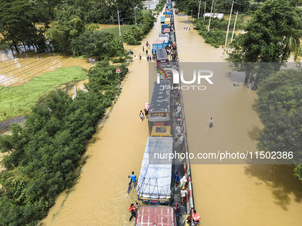 An aerial view of the flooded Dhaka-Chittagong Highway in the Muhuriganj area of Feni district in the Chittagong division of Bangladesh. At...