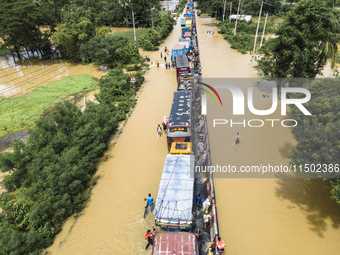 An aerial view of the flooded Dhaka-Chittagong Highway in the Muhuriganj area of Feni district in the Chittagong division of Bangladesh. At...