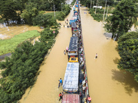 An aerial view of the flooded Dhaka-Chittagong Highway in the Muhuriganj area of Feni district in the Chittagong division of Bangladesh. At...