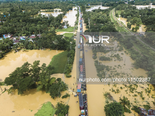 An aerial view of the flooded Dhaka-Chittagong Highway in the Muhuriganj area of Feni district in the Chittagong division of Bangladesh. At...