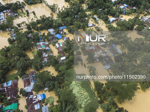 An aerial view shows flooded villages in the Muhuriganj area of Feni district in Chittagong division, Bangladesh, on August 23, 2024. At lea...