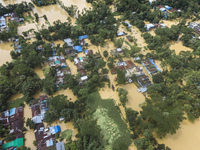 An aerial view shows flooded villages in the Muhuriganj area of Feni district in Chittagong division, Bangladesh, on August 23, 2024. At lea...