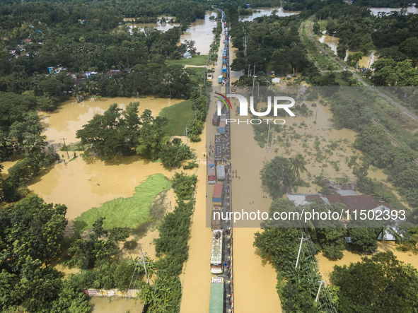 An aerial view of the flooded Dhaka-Chittagong Highway in the Muhuriganj area of Feni district in the Chittagong division of Bangladesh. At...