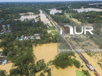 An aerial view of the flooded Dhaka-Chittagong Highway in the Muhuriganj area of Feni district in the Chittagong division of Bangladesh. At...