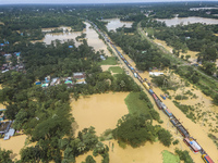 An aerial view of the flooded Dhaka-Chittagong Highway in the Muhuriganj area of Feni district in the Chittagong division of Bangladesh. At...