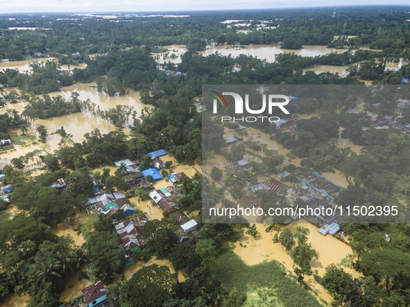 An aerial view shows flooded villages in the Muhuriganj area of Feni district in Chittagong division, Bangladesh, on August 23, 2024. At lea...