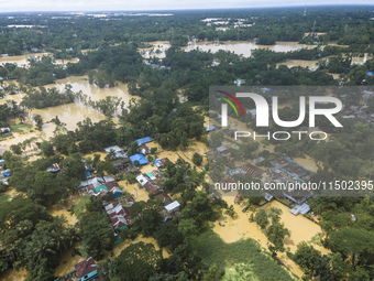 An aerial view shows flooded villages in the Muhuriganj area of Feni district in Chittagong division, Bangladesh, on August 23, 2024. At lea...