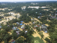 An aerial view shows flooded villages in the Muhuriganj area of Feni district in Chittagong division, Bangladesh, on August 23, 2024. At lea...