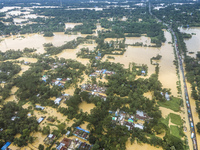 An aerial view shows flooded villages in the Muhuriganj area of Feni district in Chittagong division, Bangladesh, on August 23, 2024. At lea...