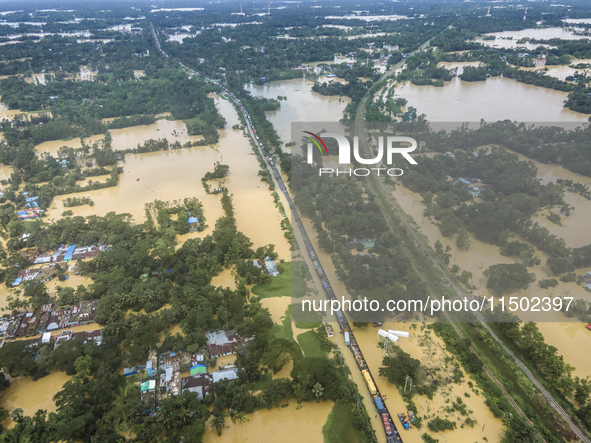 An aerial view shows flooded villages in the Muhuriganj area of Feni district in Chittagong division, Bangladesh, on August 23, 2024. At lea...