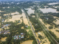 An aerial view shows flooded villages in the Muhuriganj area of Feni district in Chittagong division, Bangladesh, on August 23, 2024. At lea...