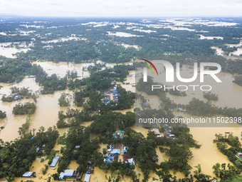 An aerial view shows flooded villages in the Muhuriganj area of Feni district in Chittagong division, Bangladesh, on August 23, 2024. At lea...