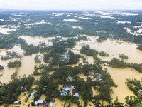 An aerial view shows flooded villages in the Muhuriganj area of Feni district in Chittagong division, Bangladesh, on August 23, 2024. At lea...