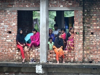 Flood-affected people take shelter in an under-construction building in Feni, Chittagong, Bangladesh, on August 23, 2024. (