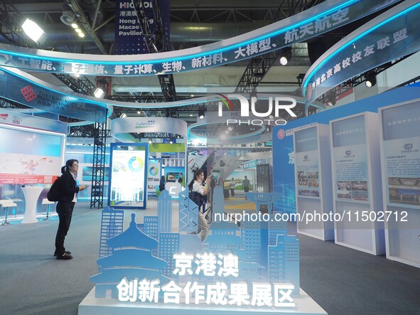 Visitors visit the Beijing-Hong Kong-Macao Innovation Cooperation Achievement Exhibition area of HICOOL 2024 Global Entrepreneurs Summit in...