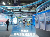 Visitors visit the Beijing-Hong Kong-Macao Innovation Cooperation Achievement Exhibition area of HICOOL 2024 Global Entrepreneurs Summit in...