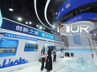 Visitors visit the Xiongan exhibition area of HICOOL 2024 Global Entrepreneurs Summit in Beijing, China, on August 23, 2024. (