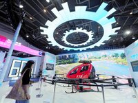 Visitors visit the ''High-rise Building Firefighting Unmanned Aircraft'' at the HICOOL 2024 Global Entrepreneurs Summit in Beijing, China, o...