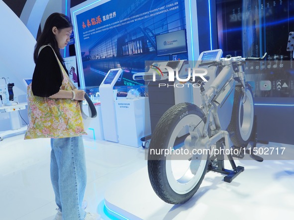 Visitors view a ''spokeless hydrogen bicycle'' at the HICOOL 2024 Global Entrepreneurs Summit in Beijing, China, on August 23, 2024. 