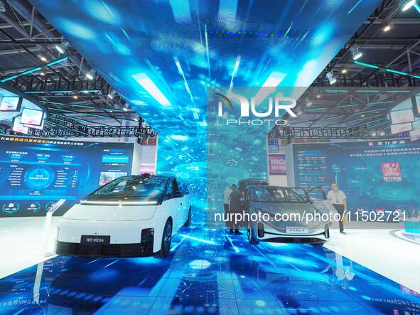 Visitors view a new energy car at the HICOOL 2024 Global Entrepreneurs Summit in Beijing, China, on August 23, 2024. 