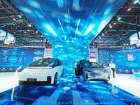 Visitors view a new energy car at the HICOOL 2024 Global Entrepreneurs Summit in Beijing, China, on August 23, 2024. (