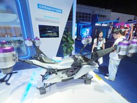 Visitors view a ''flying motorcycle'' at the HICOOL 2024 Global Entrepreneurs Summit in Beijing, China, on August 23, 2024. (