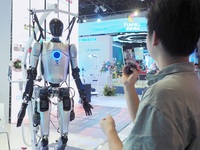 Visitors visit a ''humanoid robot'' at the HICOOL 2024 Global Entrepreneurs Summit in Beijing, China, on August 23, 2024. (