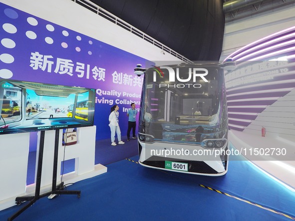 Visitors visit a ''self-driving bus'' at the HICOOL 2024 Global Entrepreneurs Summit in Beijing, China, on August 23, 2024. 