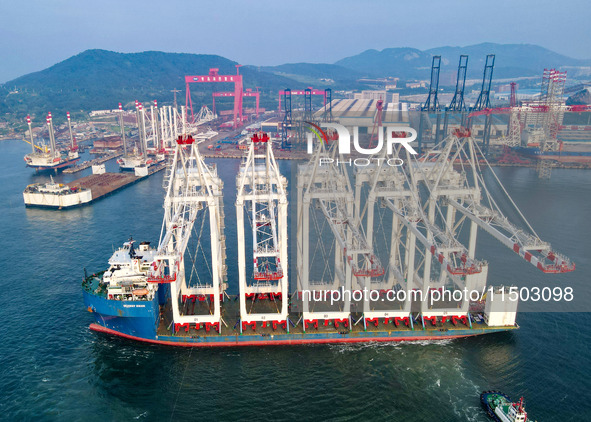 The first five ultra-large shore cranes are sent to Egypt at the West Coast New Area in Qingdao, Shandong province, China, on August 23, 202...