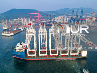 The first five ultra-large shore cranes are sent to Egypt at the West Coast New Area in Qingdao, Shandong province, China, on August 23, 202...