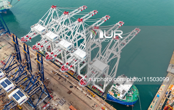 The first five ultra-large shore cranes are sent to Egypt at the West Coast New Area in Qingdao, Shandong province, China, on August 23, 202...