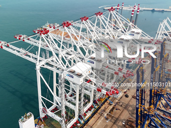 The first five ultra-large shore cranes are sent to Egypt at the West Coast New Area in Qingdao, Shandong province, China, on August 23, 202...