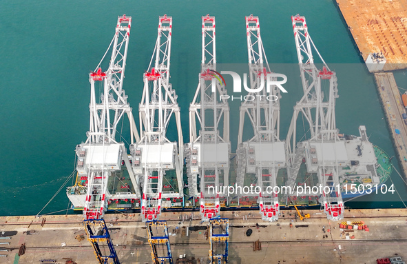 The first five ultra-large shore cranes are sent to Egypt at the West Coast New Area in Qingdao, Shandong province, China, on August 23, 202...