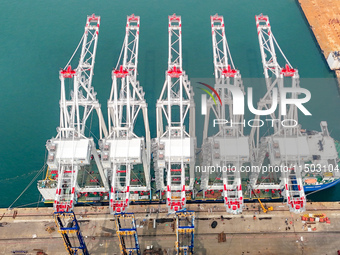 The first five ultra-large shore cranes are sent to Egypt at the West Coast New Area in Qingdao, Shandong province, China, on August 23, 202...