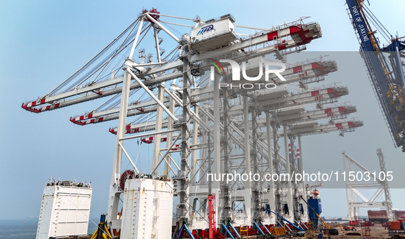 The first five ultra-large shore cranes are sent to Egypt at the West Coast New Area in Qingdao, Shandong province, China, on August 23, 202...