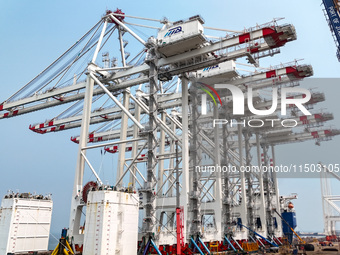 The first five ultra-large shore cranes are sent to Egypt at the West Coast New Area in Qingdao, Shandong province, China, on August 23, 202...