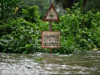 A rail crossing signal is submerged as the rail track area is flooded in Feni, Chittagong, Bangladesh, on August 23, 2024. (