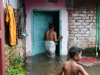 Local residents shift to temporary shelter homes as floodwater rises in their homes in Feni, Chittagong, Bangladesh, on August 23, 2024. (