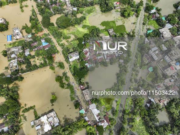 An aerial view shows flooded villages in the Mohipal area of Feni district in Chittagong division, Bangladesh, on August 23, 2024. At least...