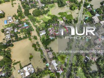 An aerial view shows flooded villages in the Mohipal area of Feni district in Chittagong division, Bangladesh, on August 23, 2024. At least...