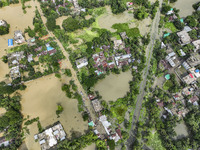 An aerial view shows flooded villages in the Mohipal area of Feni district in Chittagong division, Bangladesh, on August 23, 2024. At least...