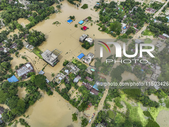 An aerial view shows flooded villages in the Mohipal area of Feni district in Chittagong division, Bangladesh, on August 23, 2024. At least...